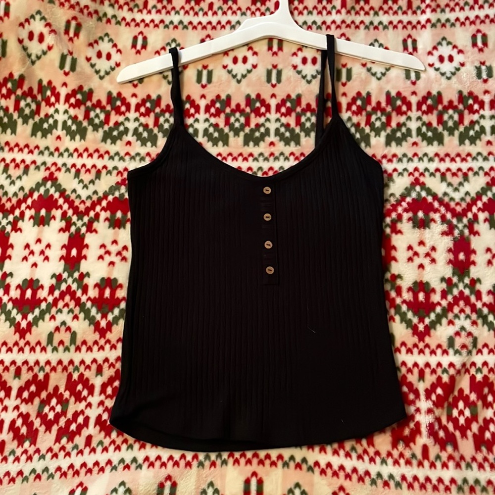 Simple black tank top with brown buttons.